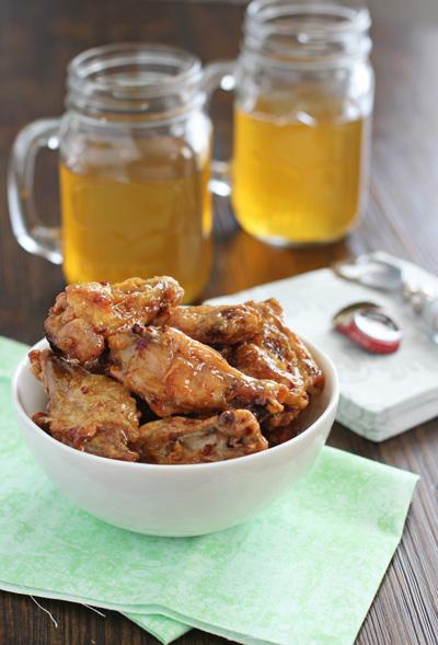 A white bowl filled with Honey Chipotle Chicken Wings.