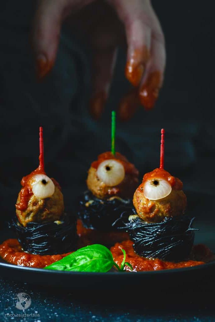 black spaghetti nests with eyeball meatballs for Halloween